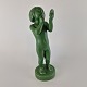 Grøn keramik 
figur af pige, 
som sminker sig 
og med et spejl 
i hånden. No 
933
Design af 
Holger ...