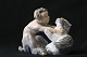Flot 
porcelænsfigur 
fra Royal 
Copenhagen, der 
forestiller 
faun med kat. 
Figuren er 
udført med ...