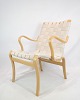 Denne lænestol, 
kendt som Model 
Mina, 
repræsenterer 
et eksemplarisk 
stykke 
møbeldesign 
skabt af ...