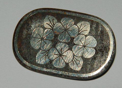 Georg Jensen brooch of iron with silver decoration of flowers
