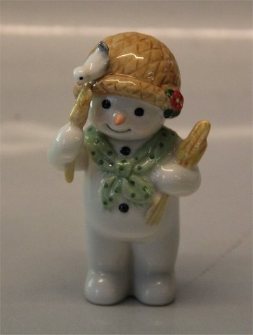 Royal Copenhagen figurine 0529 RC Winther series, Snowman, Mother Sophie with 
corns for the birds 9 cm (1249529) Henny Iversen 2008