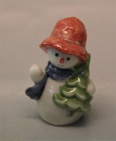 Royal Copenhagen figurine 0772 RC Snowman, Girl with Christmastree, Winther 
series figurine 6 cm (1021772) Sven Vestergaard