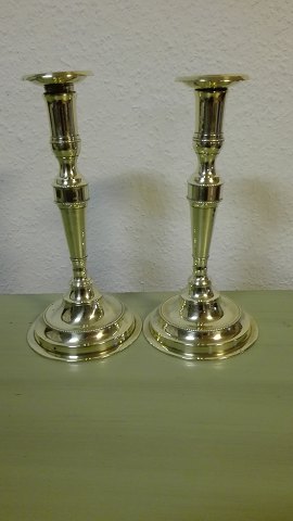 A pair of high Danish brass candlesticks stamped Lassen