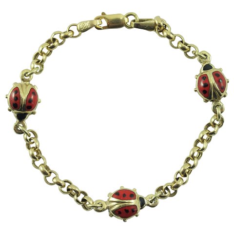 A childrens bracelet of 14k gold with enamel