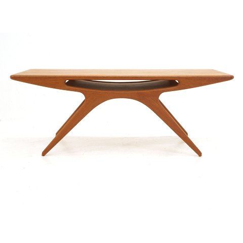 Table, Danish Design by Johannes Andersen: "The 
Smile", teak. Circa 1957. H: 51cm. L: 134cm. W: 
51cm