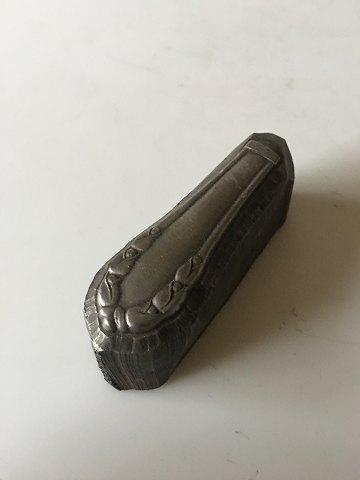 Georg Jensen Lily of the Valley paperweight in steel. A press for a knife 
handle.