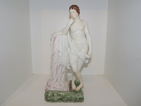 WANTED: Royal Copenhagen Overglaze figurine
Nude girl standing by marmor pedestal