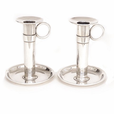 A pair of Hans Hansen Sterlingsilver candlesticks. 
H: 10,5cm. W: 329gr (both)