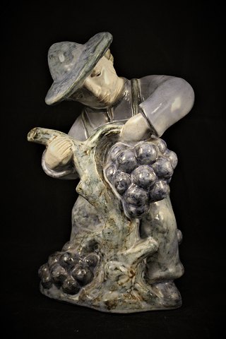Glazed ceramic figure from L.Hjorth - Denmark. of grape picker.
H: 25cm.