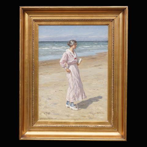N. F. Schiøttz-Jensen, 1855-1941: Woman at the 
beach at Lønstrup, Denmark. Oil on canvas. Signed 
and dated 1916. Visible size: 48x34cm. With frame: 
66x80cm