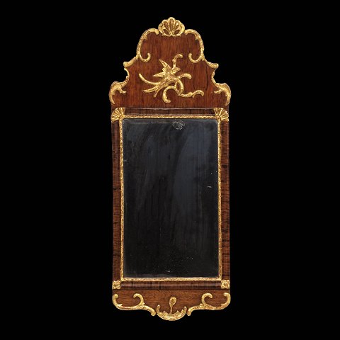 A gilt mahogany and walnut mirror. Denmark circa 
1770. Size: 80x31cm