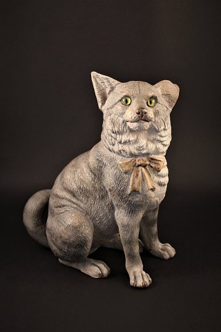 1800 Century painted terracotta figure of cat with glass eyes and with a fine 
patina. H: 24cm.