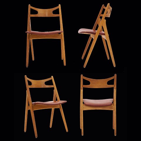 Hans J. Wegner: Satz von vier "Sawhorse"-Stühlen. 
Ein Stuhl mit kleiner Reparatur. Ledersitze 
patiniert