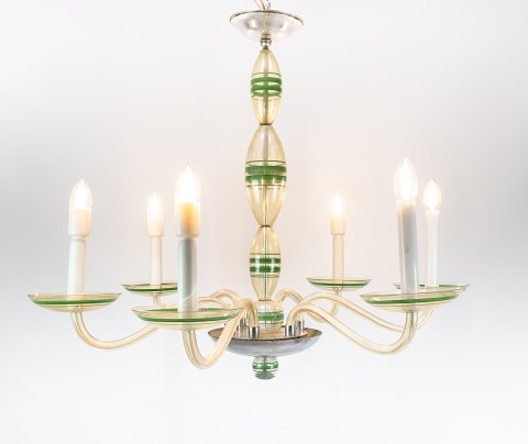 Chandelier of opaline glass decorated with green colours.
5000m2 showroom.