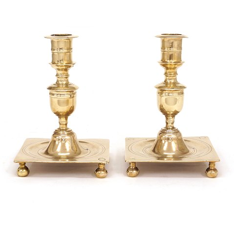 A pair of mid 18th century brass candlesticks. 
Denmark circa 1740. H: 22cm. Base: 15x15cm