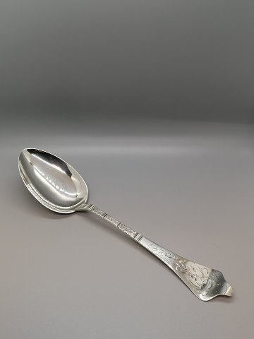 Antique Rococo serving spoon made of three-tower silver