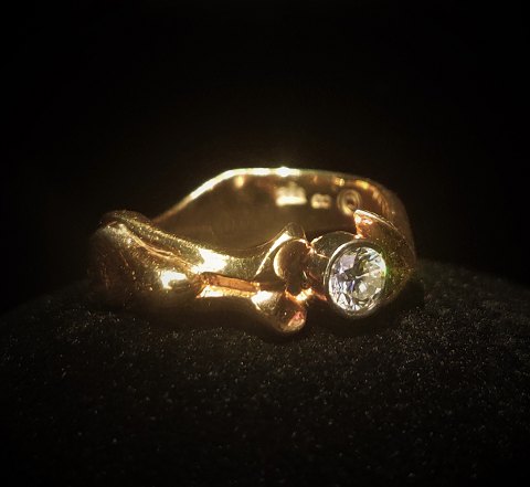 Carat Design Aalborg; A 14k gold ring set with a brillant 0,50 ct. W-VVS