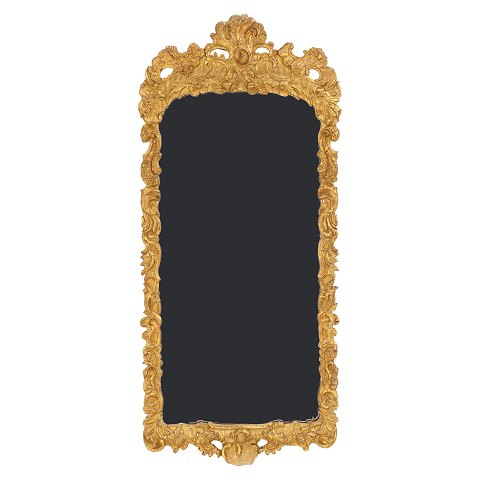 A gilt wood cut Rococo mirror. Denmark circa 1760. 
Measures: 114x52cm