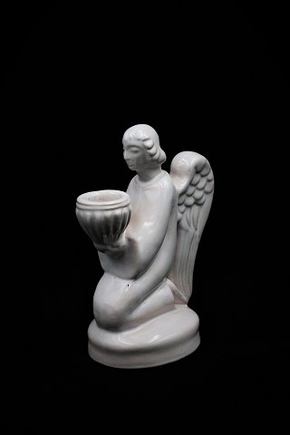 White glazed Christmas angel from Hjorth ceramics - Denmark, 
which holds a candle...