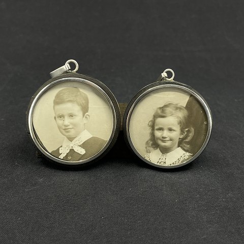 A set of pendants with room for pictures