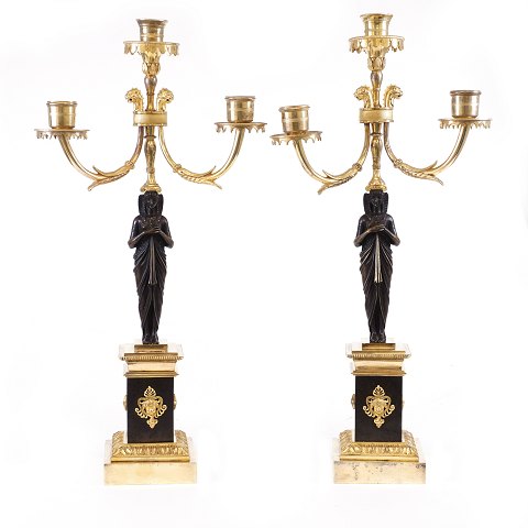 A pair of fire gilt Empire bronze candelabra. 
France circa 1820. H: 51cm
