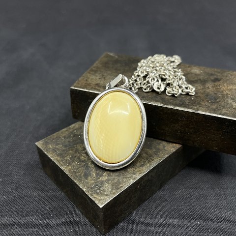 Pendant with ivory from N. E. From