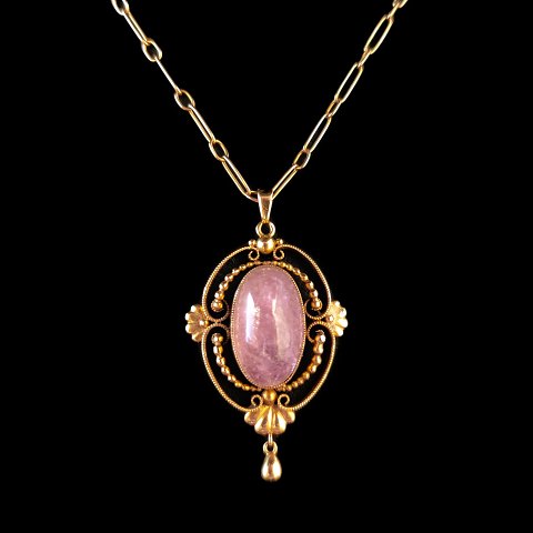 Georg Jensen; A necklace in 18k gold set with a rose quartz