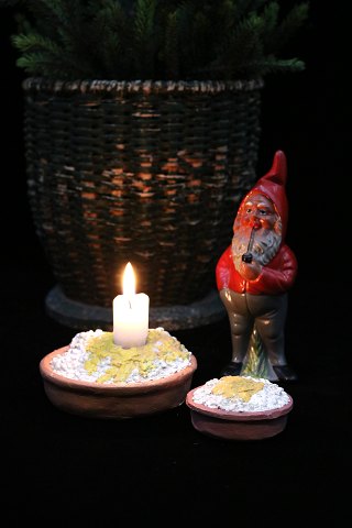 Old bowl with rice porridge in painted plaster with room for a candle…