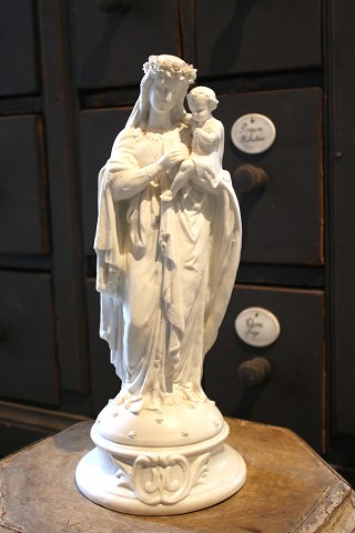 Fine, old Madonna figurine with the baby Jesus on her arm in white porcelain 
with many fine details...