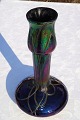 Stor smuk 
glasvase med 
lustr glasur i 
flotte farver. 
Højde 28 cm. 
bredde i bund 
15 cm. Stand et 
...