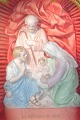 Religious 
figure, Mary 
and Joseph with 
Jesus, painted 
biscuit, 
mounted in 
wooden frame 
with glass.
