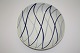 Harlekin/Blå 
flamme Dan-ild 
Lyngby. Design 
Axel Brüel i 
1958. Ildfast 
porcelæn blev 
solgt under ...