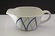 Harlekin/Blå 
flamme Dan-ild 
Lyngby. Design 
Axel Brüel i 
1958. Ildfast 
porcelæn blev 
solgt under ...