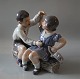 1 x 1. factory
Dahl Jensen 
1214 Boy & Girl 
with ship (DJ) 
20.5 cm Marked 
with the Royal 
Crown ...