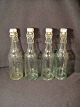 1/4 l 
vandflaske med 
inskr. 
Carlsberg på 
skulderen og 
hagekors i 
bunden og på 
patentproppen