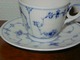 Royal 
Copenhagen 
Musselmalet 
Riflet, 
Kaffekop og 
underkop 
Dek.nr. 1/298. 

Koppens ...