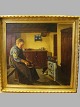 Maleri.
Kone laver mad 
i køkkenet, 
mens hunden 
spiser.
Signeret. Sand 
Holm 1934. ( 
Peter ...