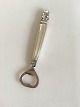 Georg Jensen 
Sterling Sølv 
Konge 
Øloplukker No 
272. Måler 16,4 
cm. Design 
Johan Rohde. 
