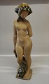 Copenhagen Art Pottery
by Helge Christophersen Nude woman with green glazed sharf 52 cm