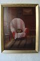 Ubekendt 
kunstner (20 
årh):
Interiør med 
lænestol og 
sammenrullet 
kat.
Olie på pap.
Sign.: ...