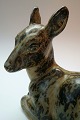 Kgl. figur 
nr.20506 
liggende hjort 
i stentøj 
designet af 
Knud Kyhn. 1 
sortering.  
Højde ca. 22 
...