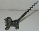 
Corkscrew on 
the dog. Figure 
of dog in 
metal. Tail as 
corkscrew. In 
good condition.