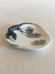 Royal 
Copenhagen 
Lizard and 
snail dish No 
630/308. 
Measures 12cm. 
Repaired on the 
rim. We do ...