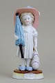 Milano, G. 
Richardi, 
ca.1860-70. 
Pige med 
sommerhat, 
taske og 
paraply i 
porcelæn. 
Håndmalet i ...