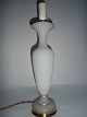 Opaline lamp in 
matt white 
opaline, fitted 
with brass base 
and top, 
France, approx. 
1920.
50cm. ...