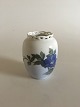 Royal 
Copenhagen Art 
Nouveau Vase 
with pierced 
top No 
1763/160. 
Measures 10,3cm 
and is in ...