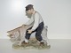 Royal 
Copenhagen 
figur, 
bondemand med 
gris.
Af 
fabriksmærket 
kan det 
udledes, at 
denne er ...