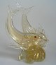 Venetian glass 
figure of two 
jumping 
dolphins. 
1960's, Italy. 
Clear glass 
with inner gold 
and ...