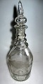 Egeløv's 
carafe, 19th 
century. 
Barrel-shaped. 
Blown-in fluted 
bottom. The 
neck is lined 
with ...