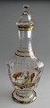 Carafe, c. 
1900, decorated 
with enamel 
painting in the 
form of a 
rococo scene. 
Germany. 
Angular ...